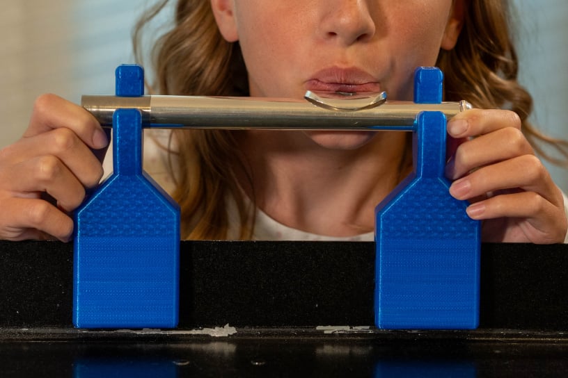 Girl using the Flute Holder Pro with a flute head joint